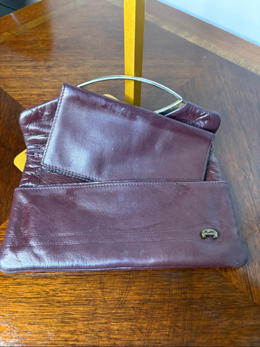 Aigner Women’s Burgundy Leather Clutch with Gold Accent - Picture 4 of 4